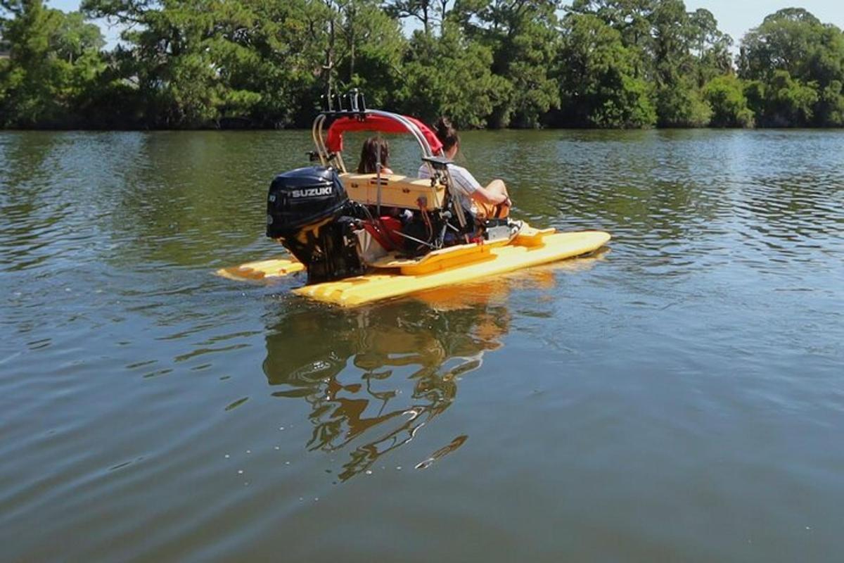 a yellow and red boat in the water
