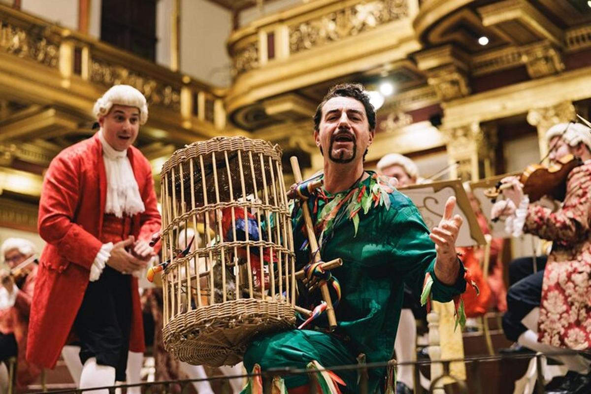 a man in a costume holding a bird cage