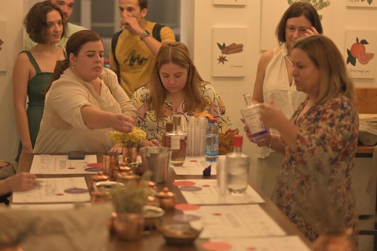 a group of people standing around a table