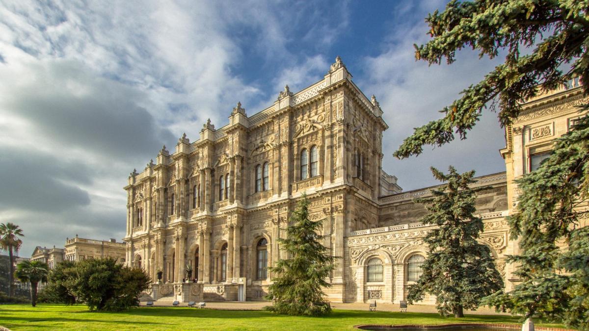 a large building with trees in front of it