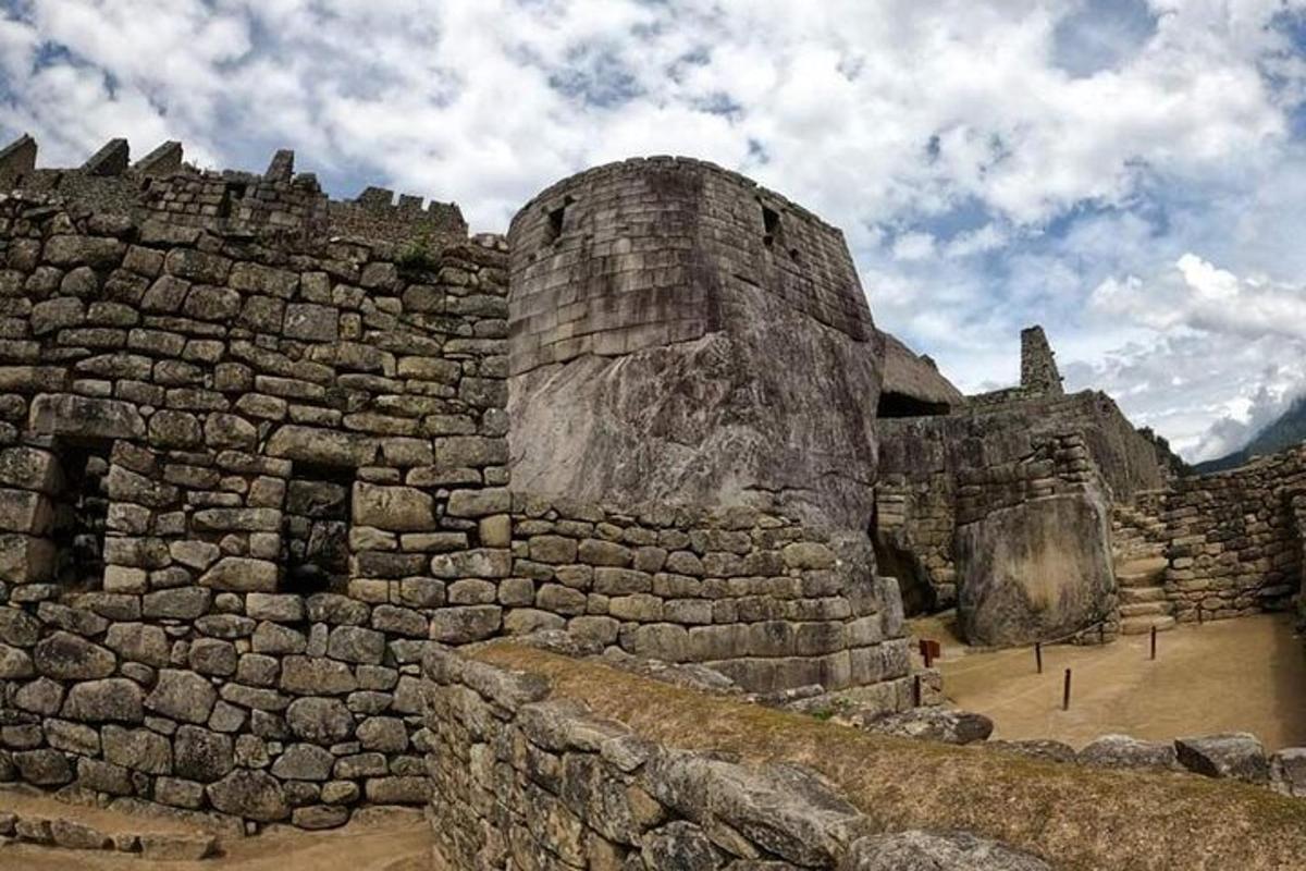 an old stone building on top of a mountain