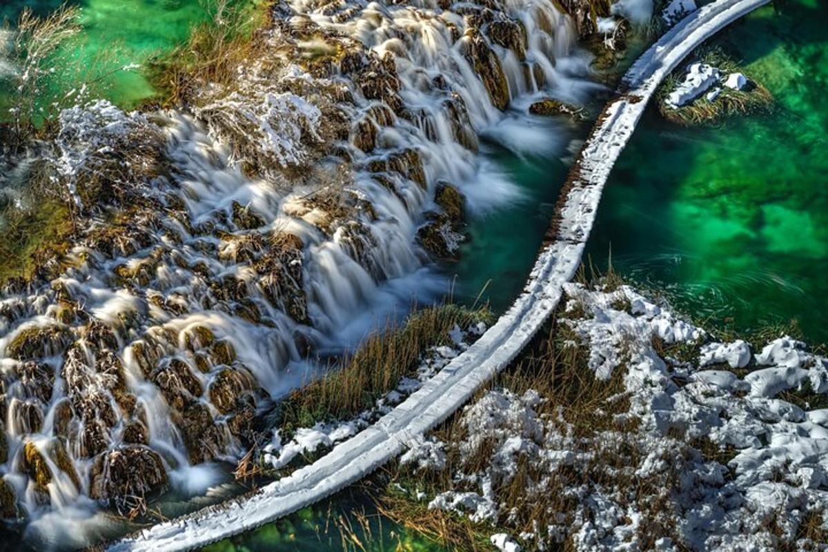 an aerial view of a waterfall in a river