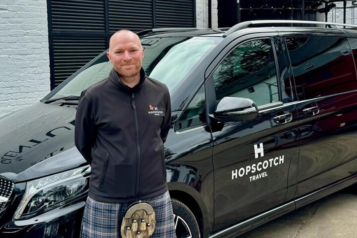 a man is standing in front of a van