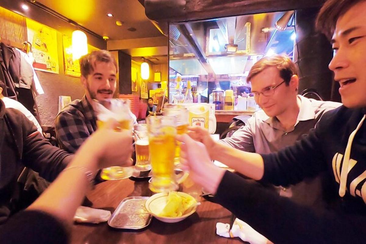 a group of people sitting around a table with drinks