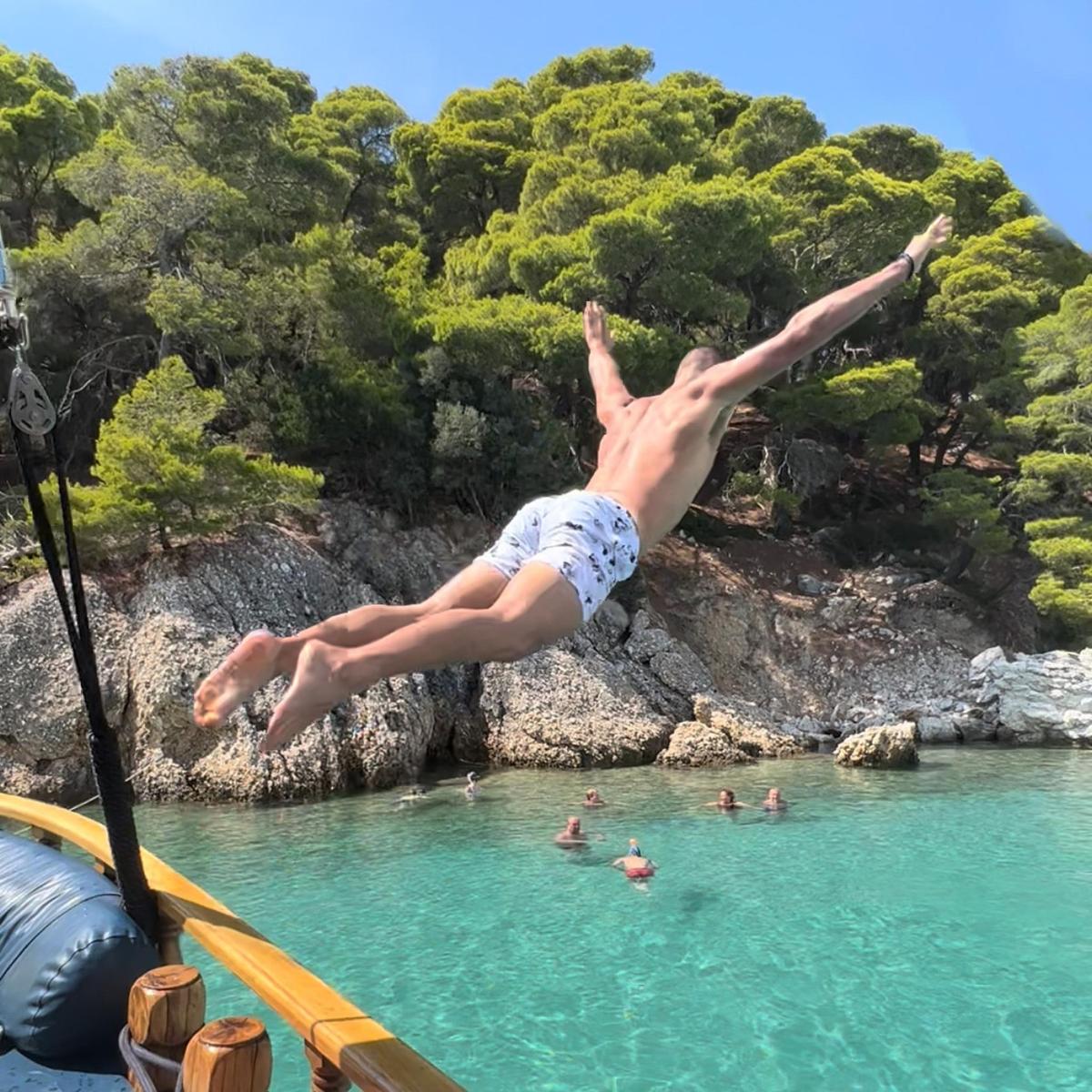 a person jumping off a raft into the water