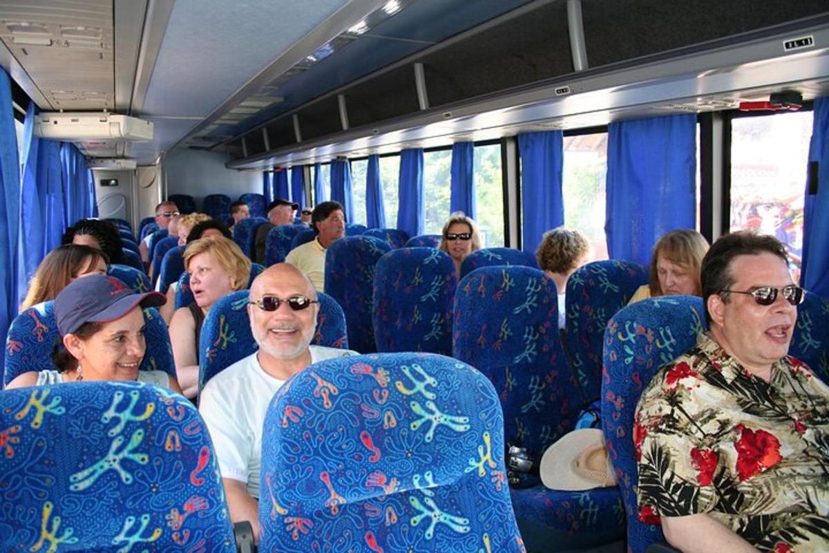 a group of people sitting on a bus
