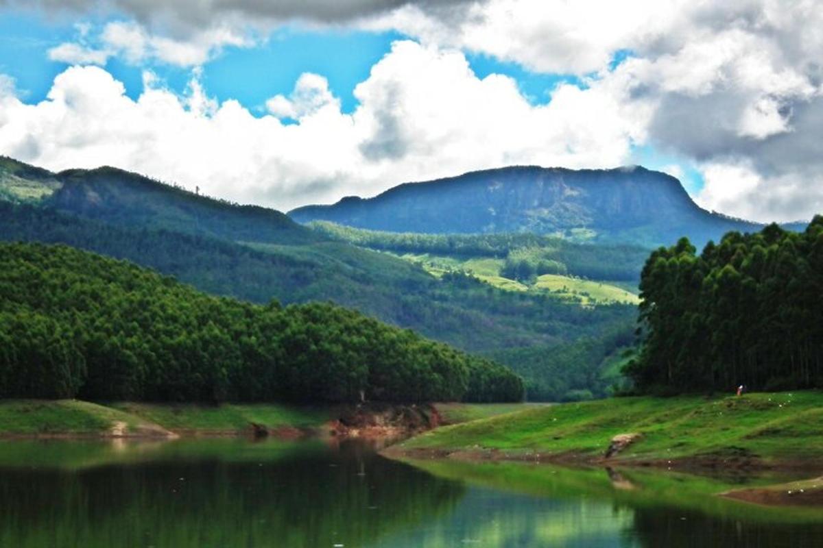 a view of a river with mountains in the background