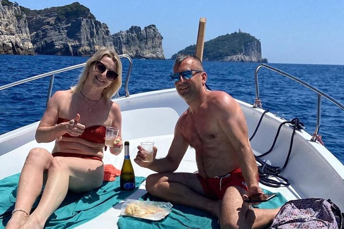 a man and a woman sitting on a boat
