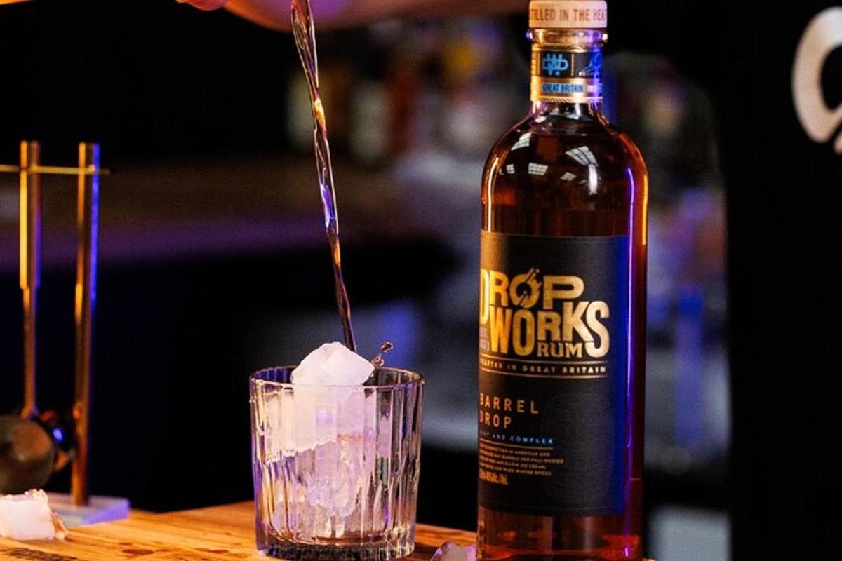 a bottle of alcohol sitting next to a drink