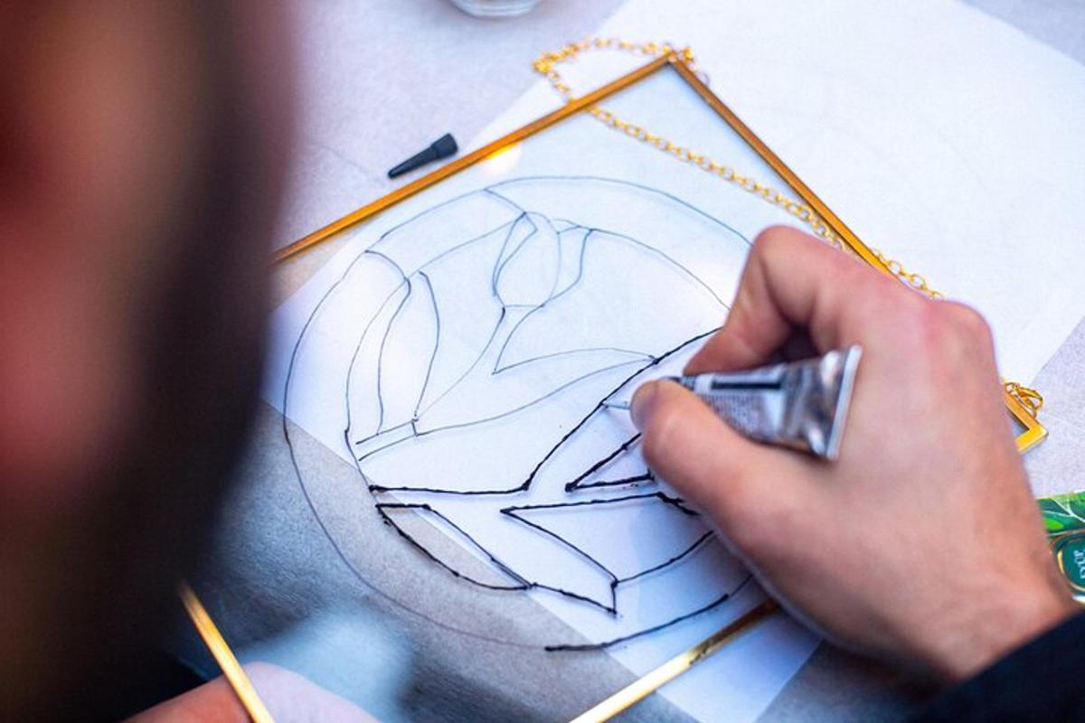 a person holding a drawing of a cartoon