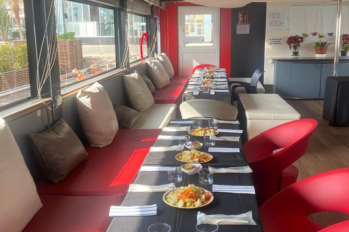 a long row of tables with plates of food