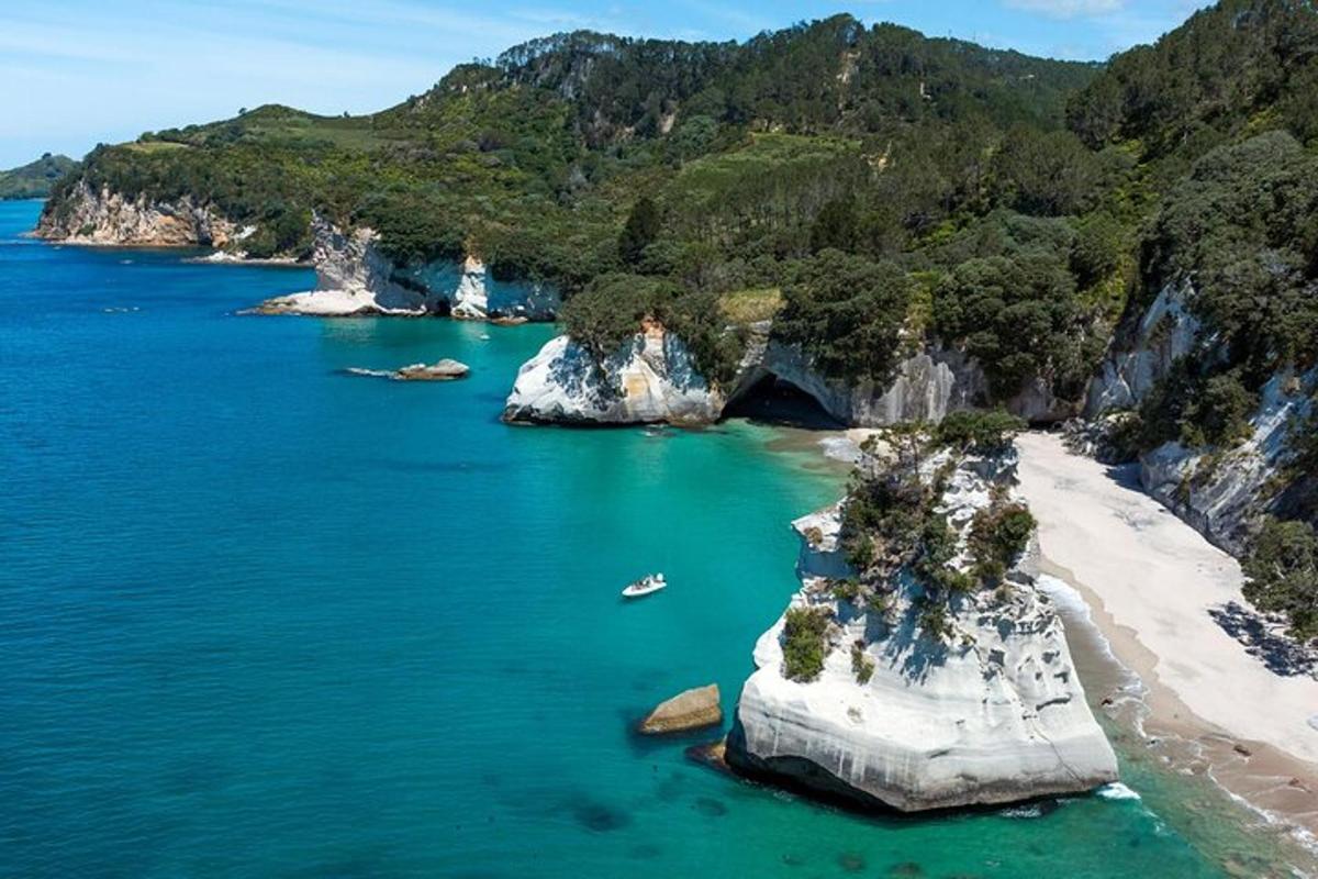 an island in the ocean next to a beach