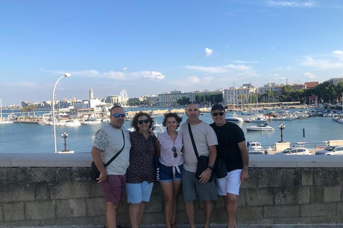 a group of people standing in front of a harbor