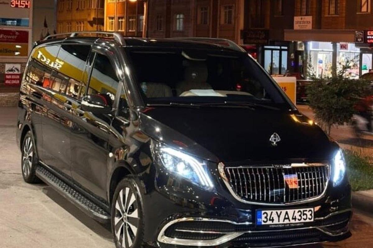 a black car parked in a parking lot