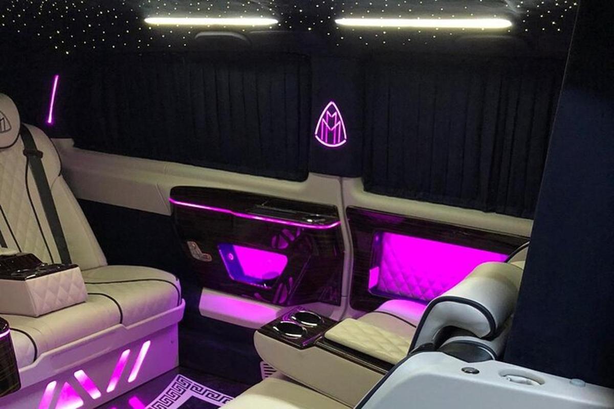 a limousine with pink lights in the back