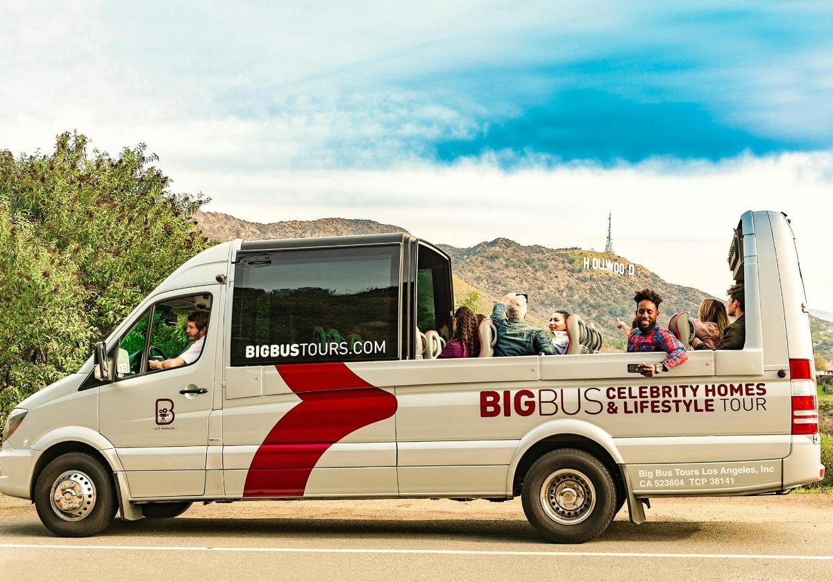a bus with people sitting in the back of it
