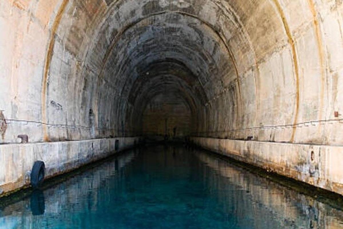 a tunnel with water in the middle of it