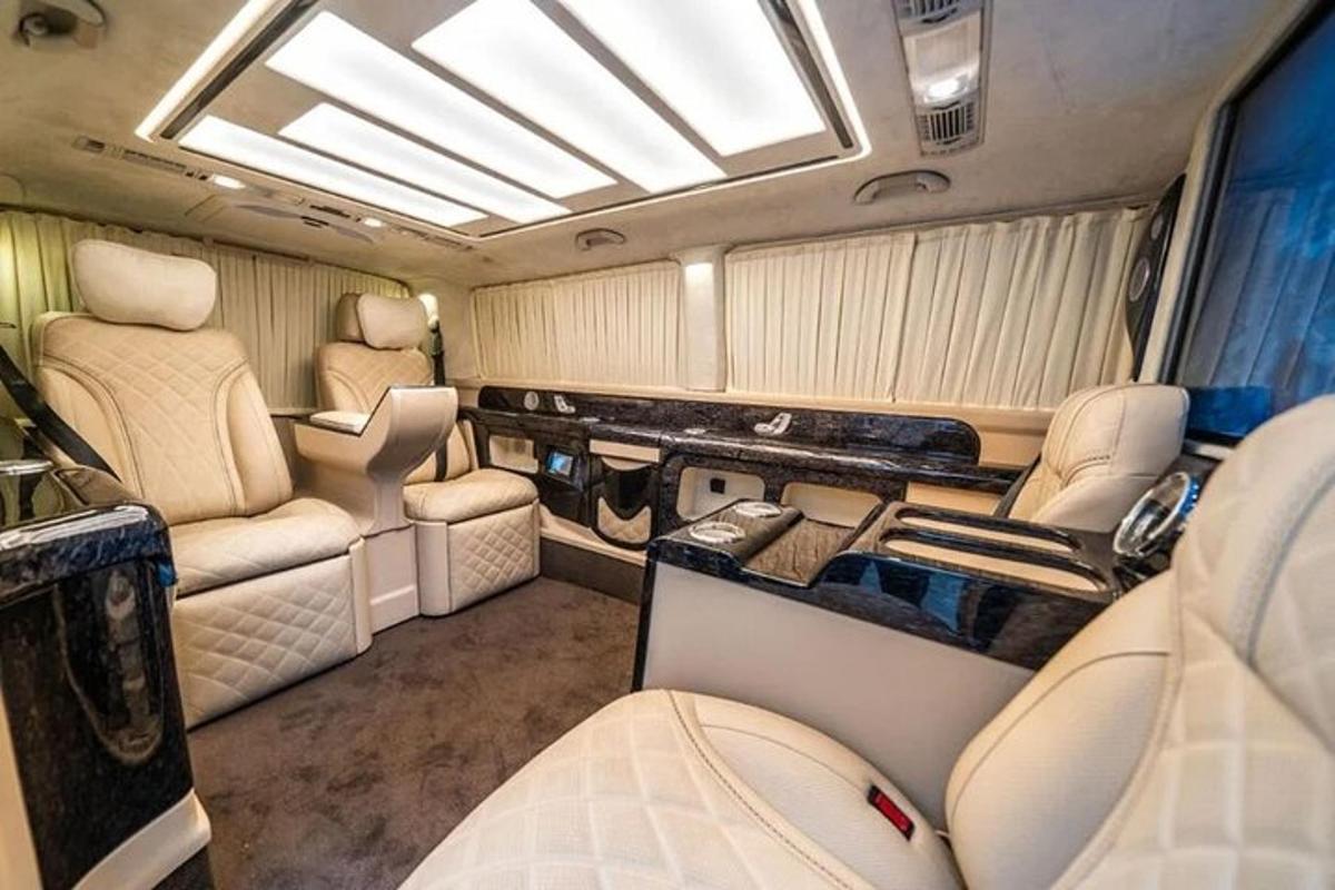 an interior of an rv with seats and a window