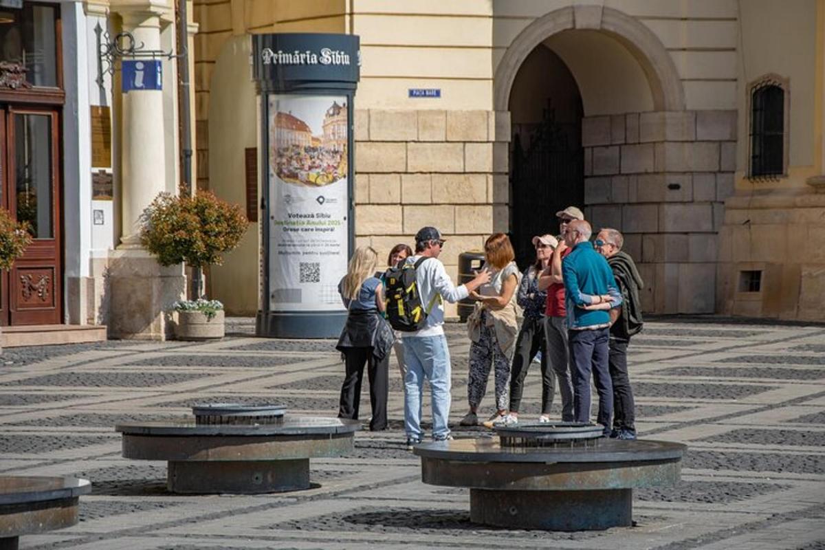a group of people standing in front of a fountain