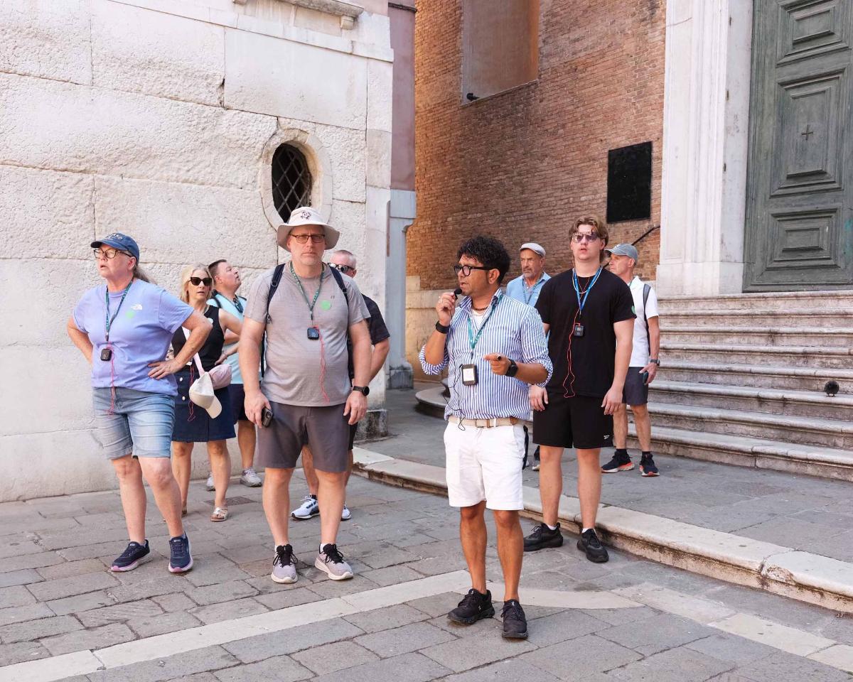 a group of people standing outside of a building