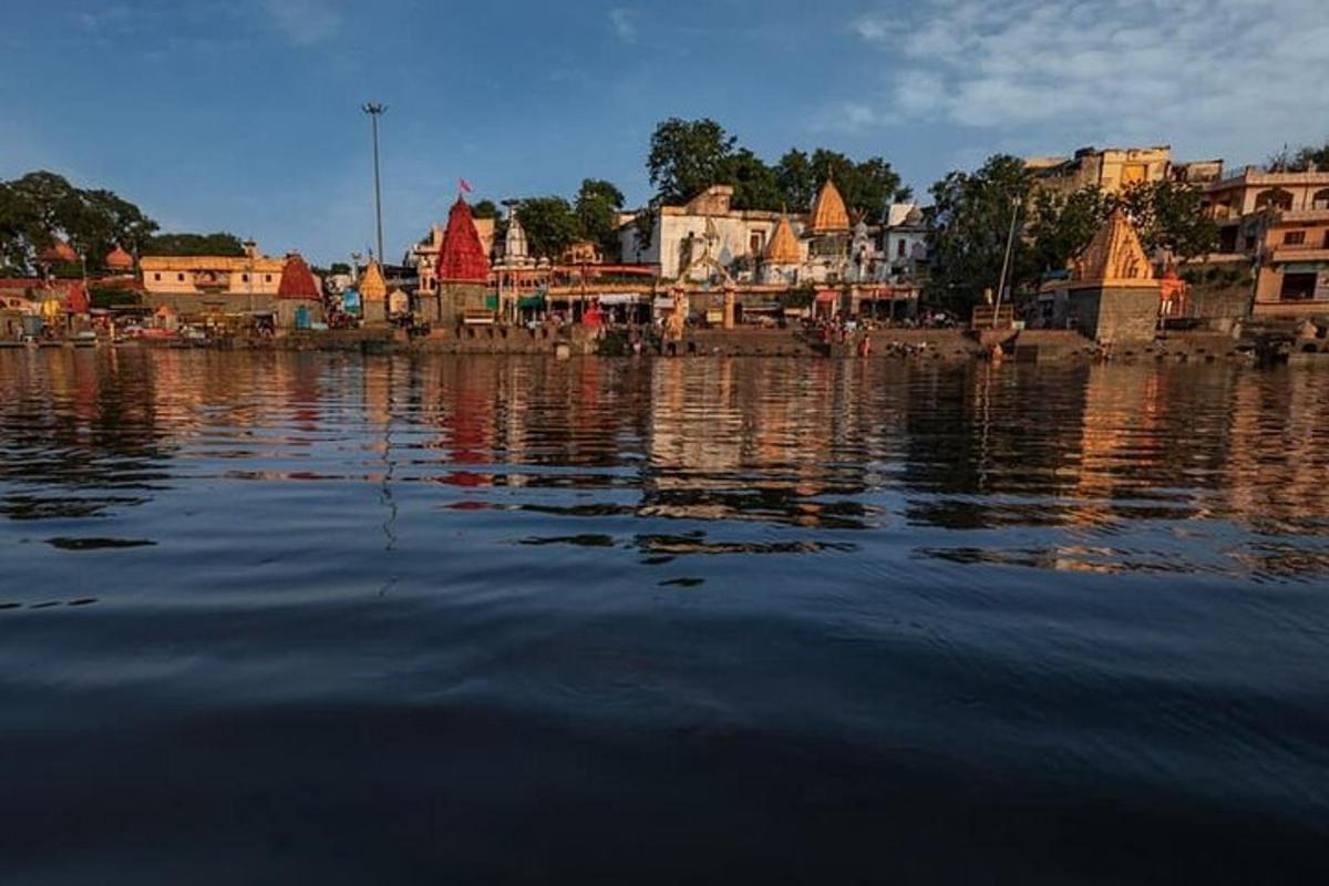 a large body of water with buildings in the background