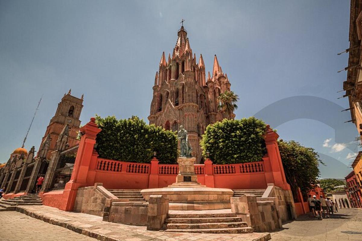 a large building with a statue in front of it