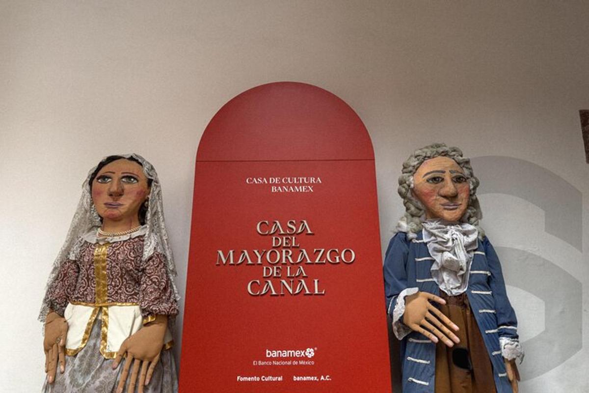 a statue of a woman standing next to a snowboard