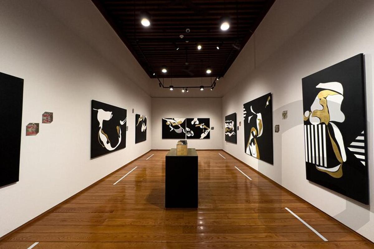 a gallery with paintings on the walls of a museum