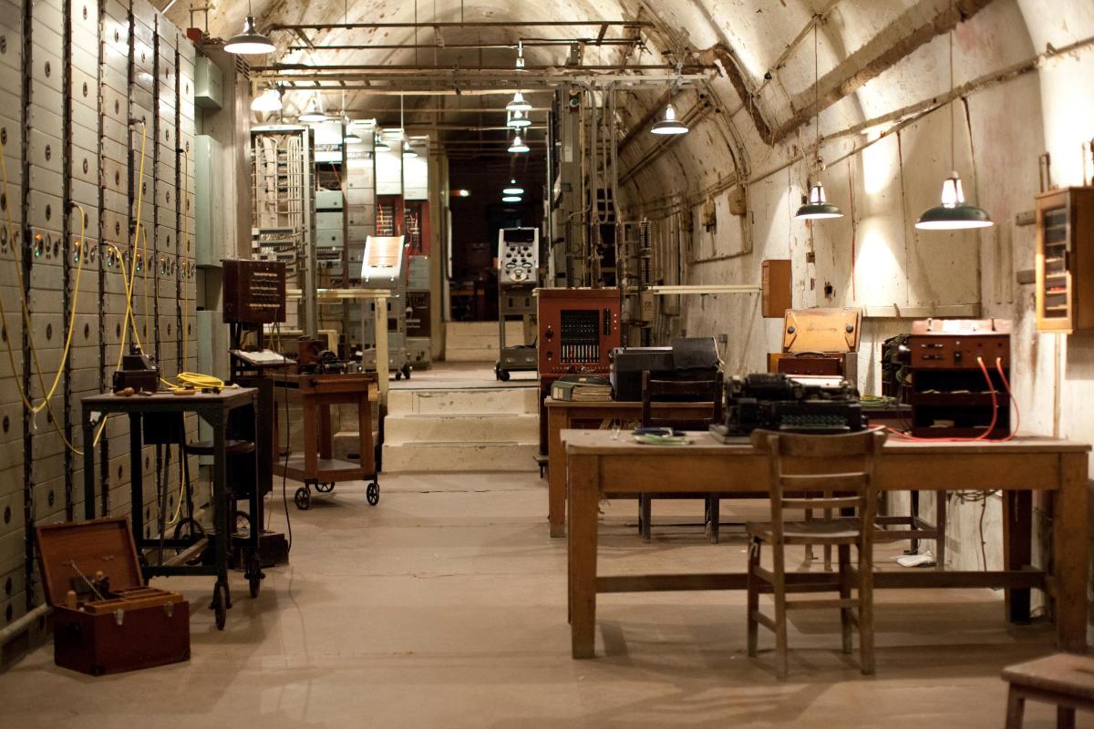a large room with tables and chairs in it