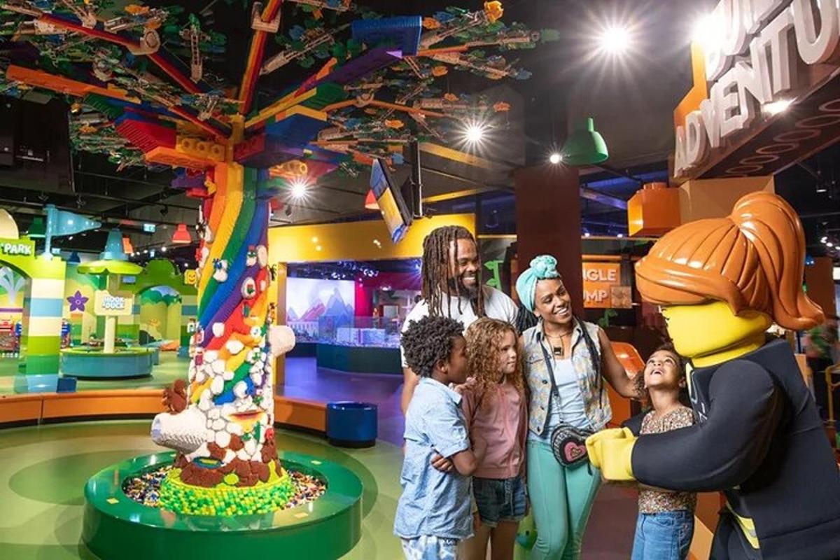 a group of people standing in front of a play center