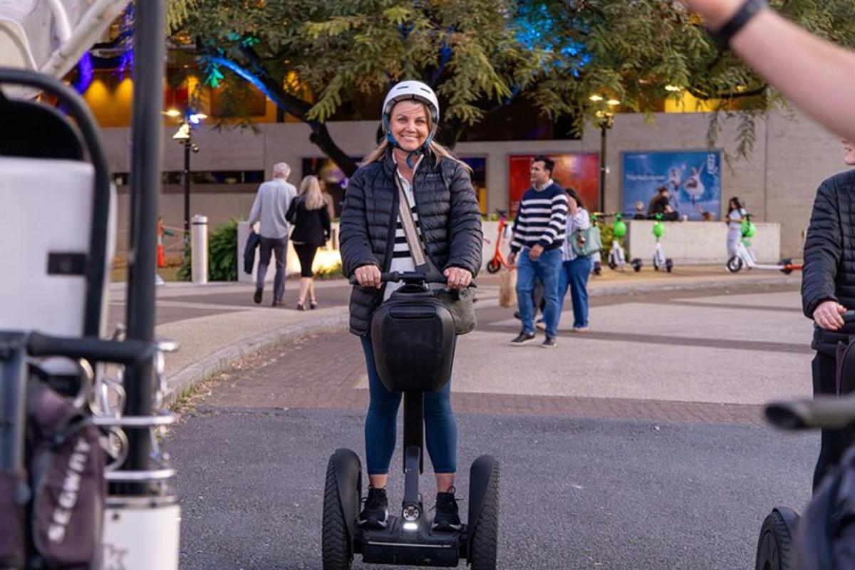 a woman riding a scooter on a street