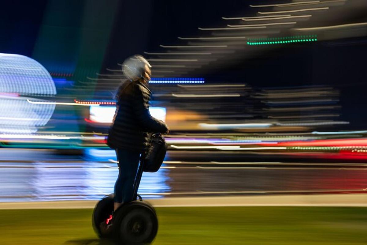 a person riding a scooter on a street