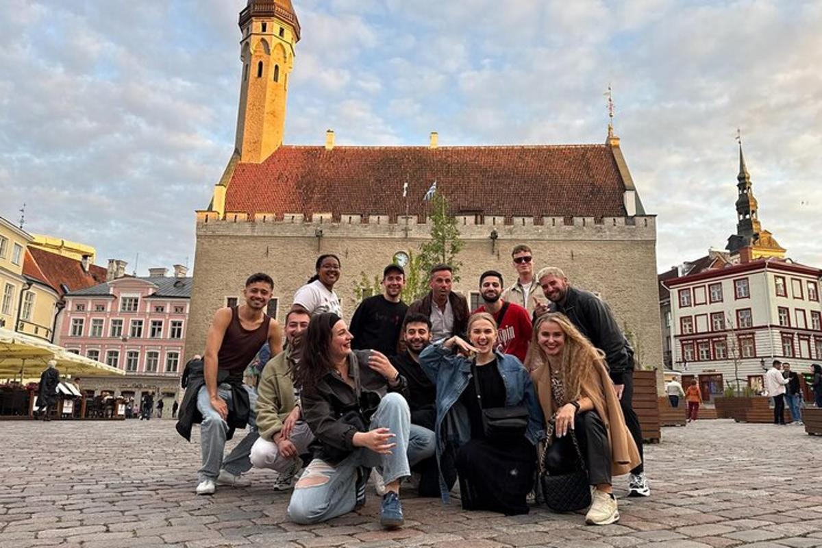 a group of people posing in front of a building