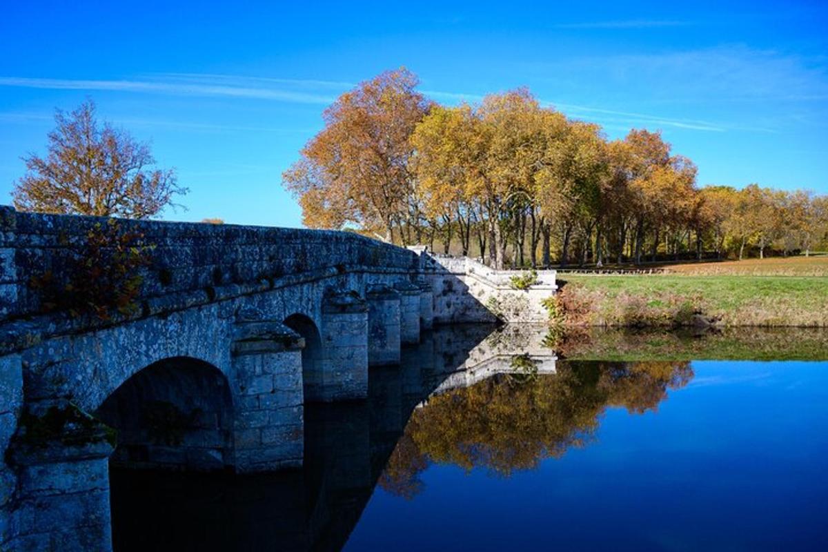 a stone bridge over a body of water