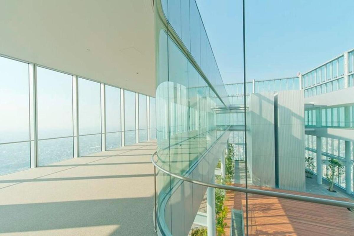 a glass building with a view of the ocean