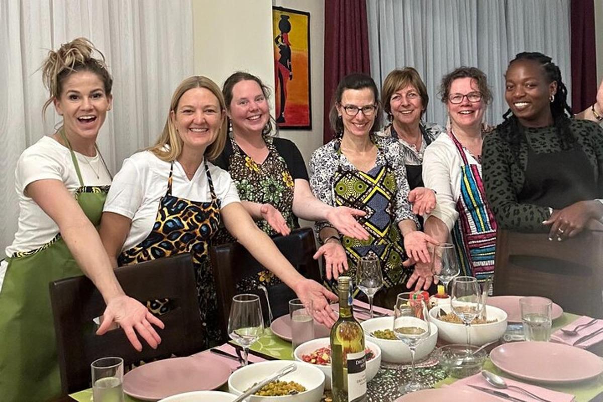 a group of women standing around a table