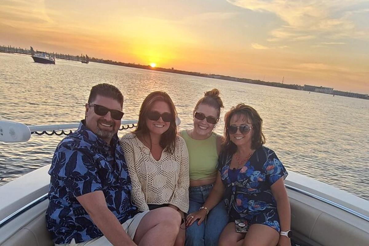 a group of people sitting on a boat in the water