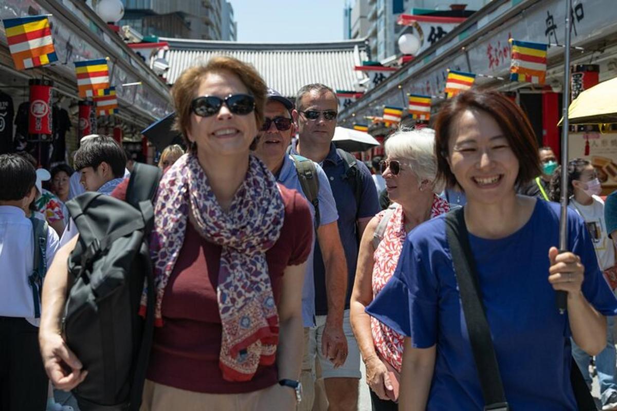 a group of people walking through a market