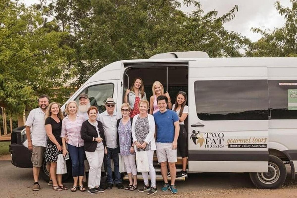 a group of people standing in front of a van