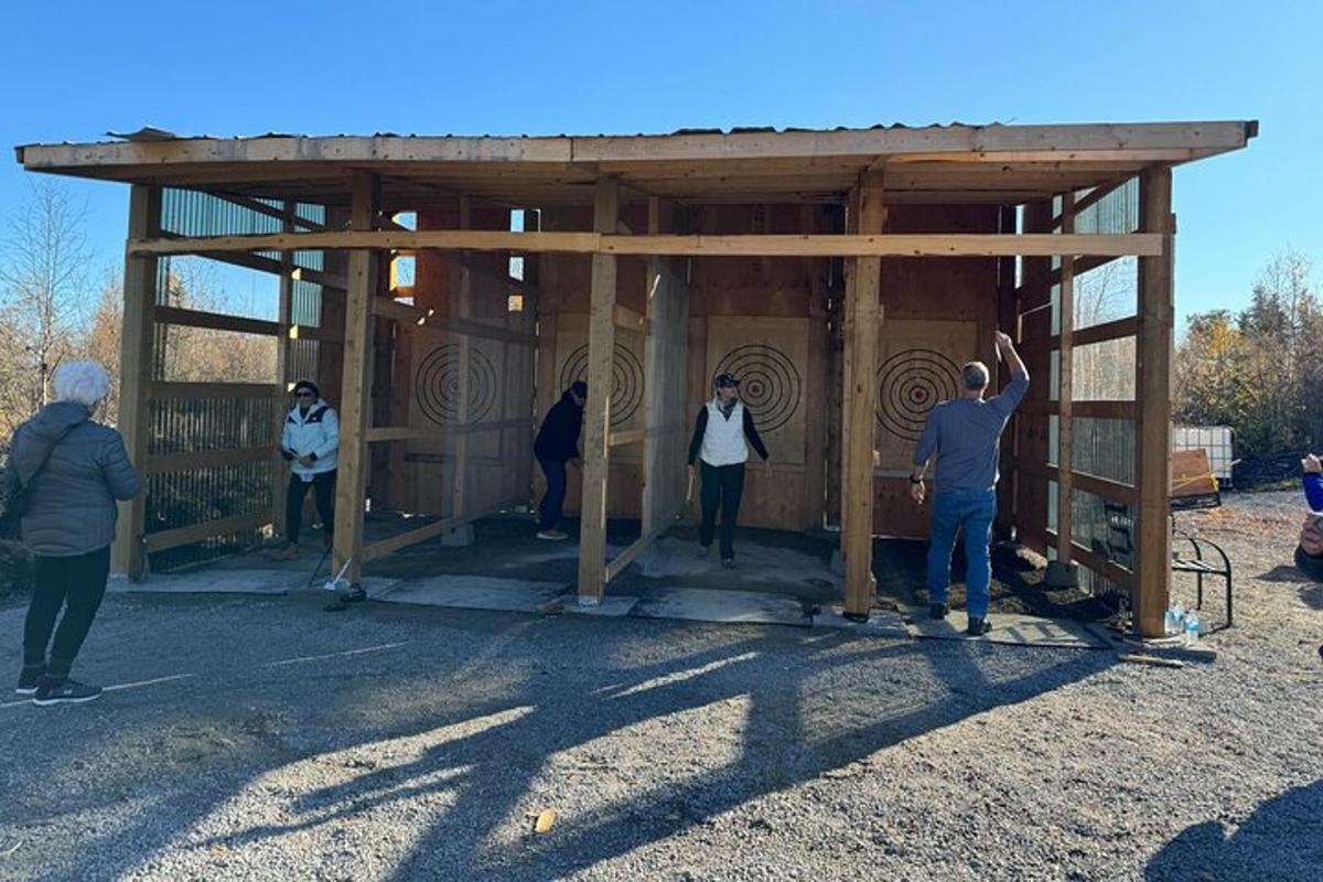 a group of people standing inside of a wooden building
