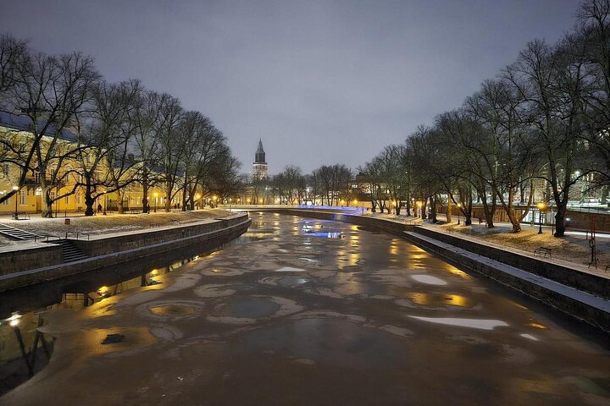 a view of a river with a clock tower in the background