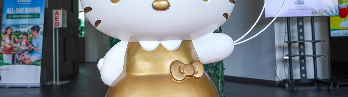 a teddy bear dressed in a gold dress