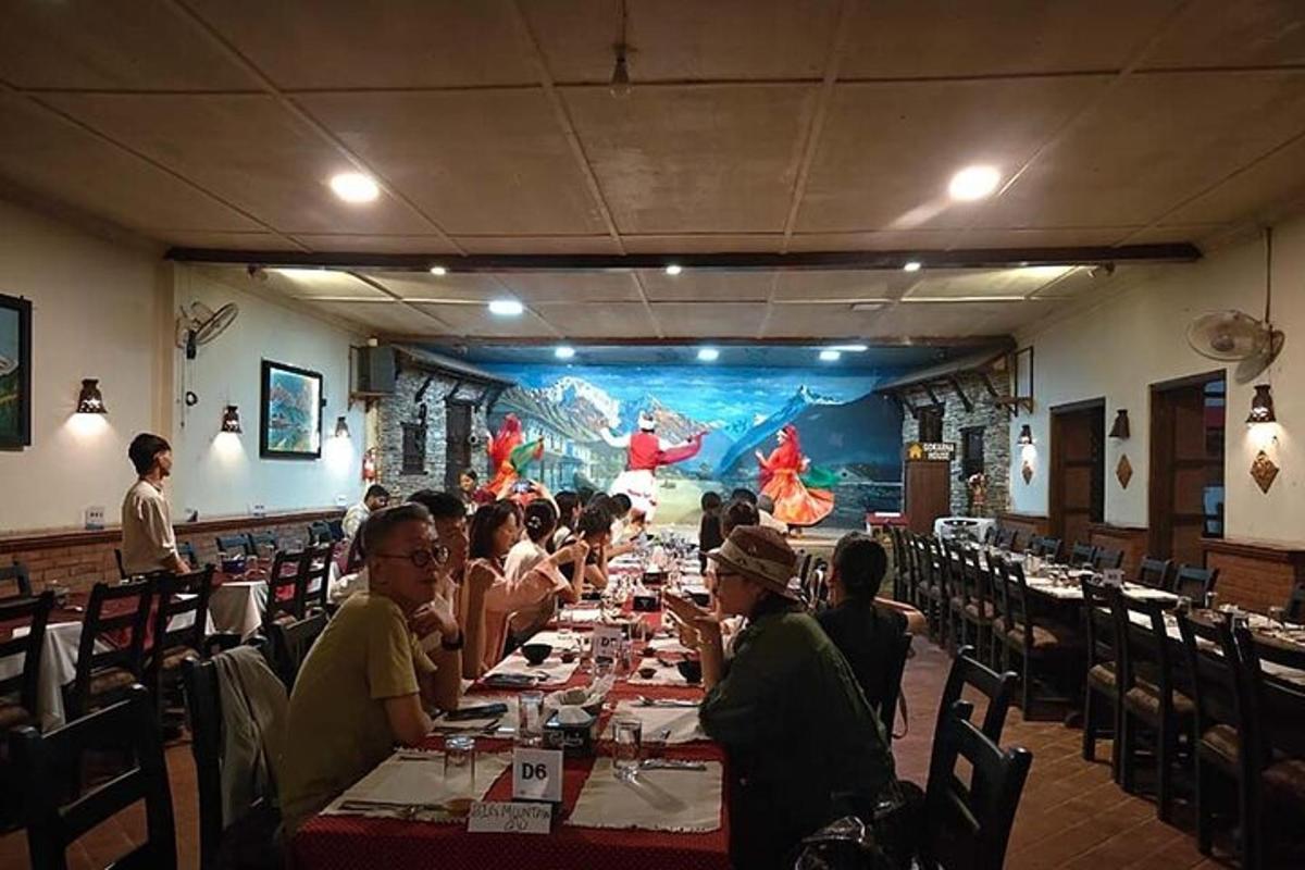 a group of people sitting at tables in a restaurant