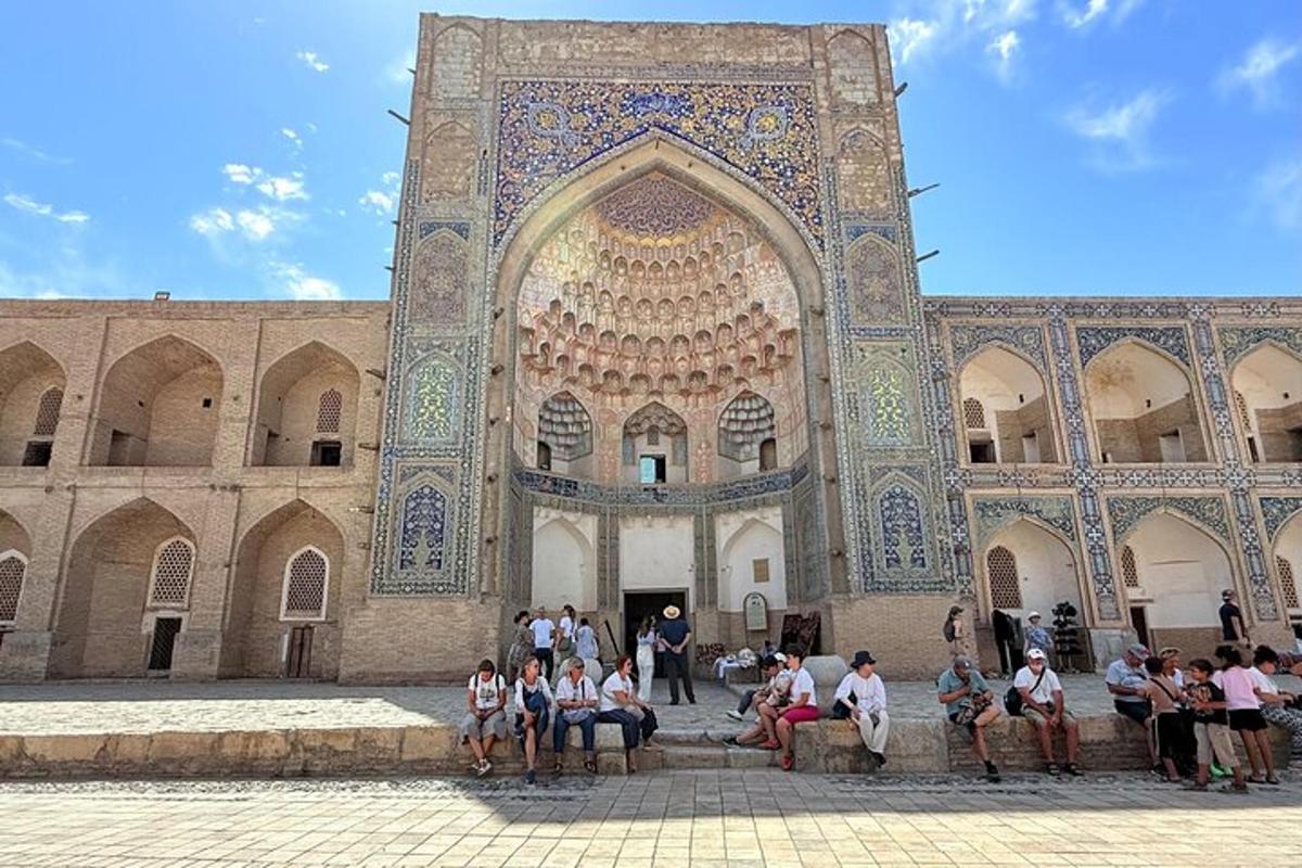 a group of people sitting in front of a building