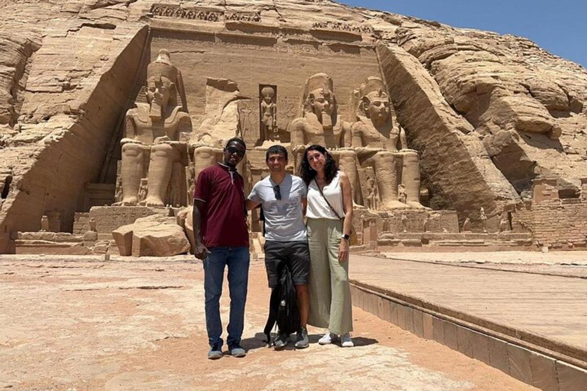 three people are standing in front of anaraoh