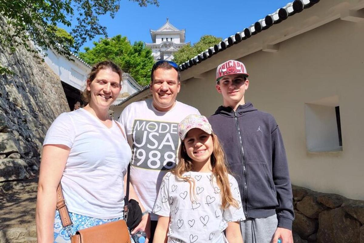 a family posing for a picture in front of a building