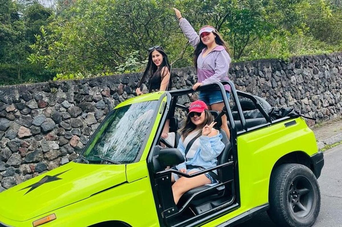 three girls riding in the back of a truck