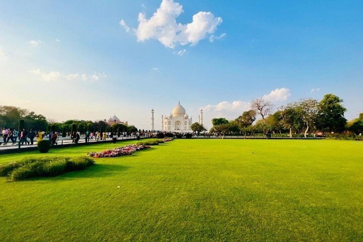 a green field with a building in the background