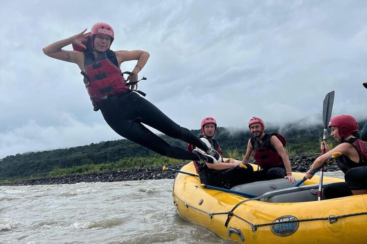 a group of people on a raft in the water