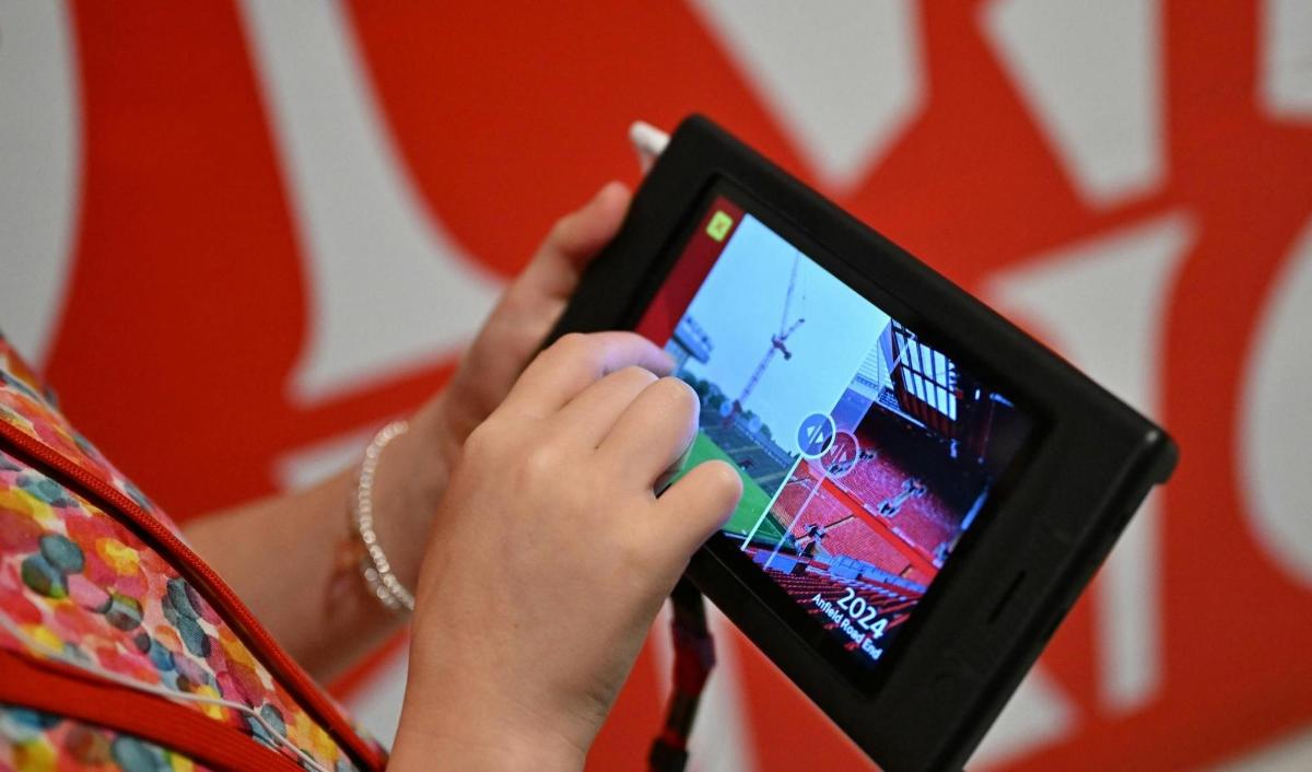 a woman holding a tablet computer in her hands